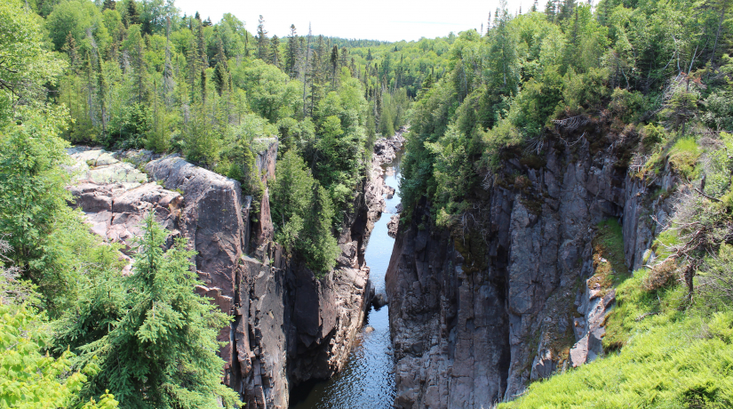 Gorge with trees on edge and water in centre, northwestern Ontario