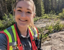 A female geology student conducting fieldwork 