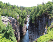 Gorge with trees on edge and water in centre, northwestern Ontario